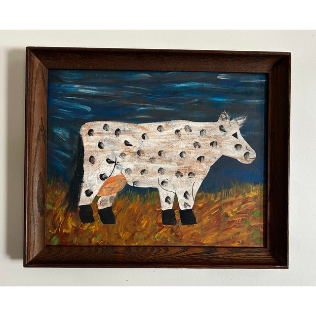 Primitive, abstract, original painting on canvas of a cow. In vintage natural wood frame. Signed to the lower right.