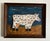Primitive, abstract, original painting on canvas of a cow. In vintage natural wood frame. Signed to the lower right.
