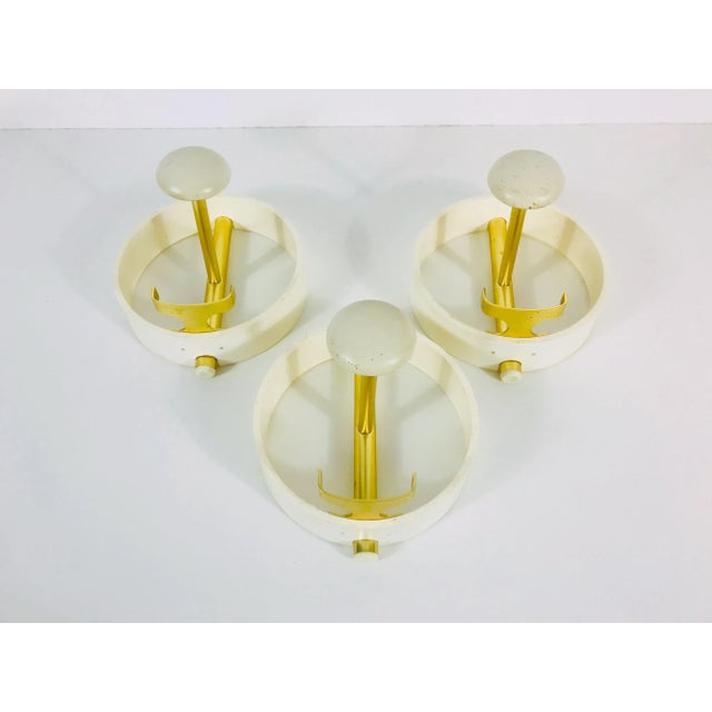 Outstanding set of 3 coat racks from Germany 1960s. They have a beautiful midcentury design and are made from brass and...