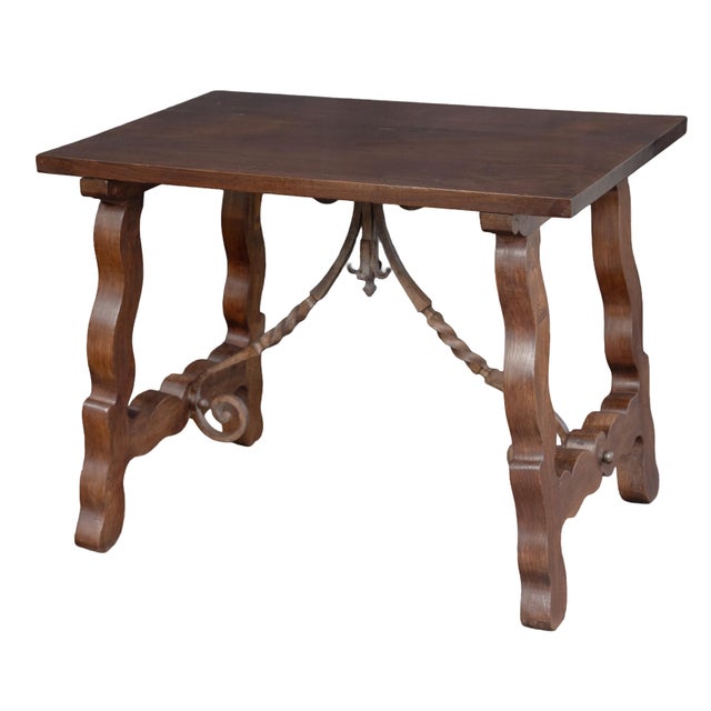 A handsome Spanish console or Fratino table, in the Baroque style, featuring a rectangular plank top over a base with two...