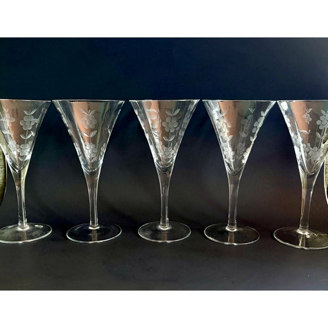 Elegant set of five vintage mid-century goblets featuring trumpet-shaped bowls with vertical optic ribbing and delicate...