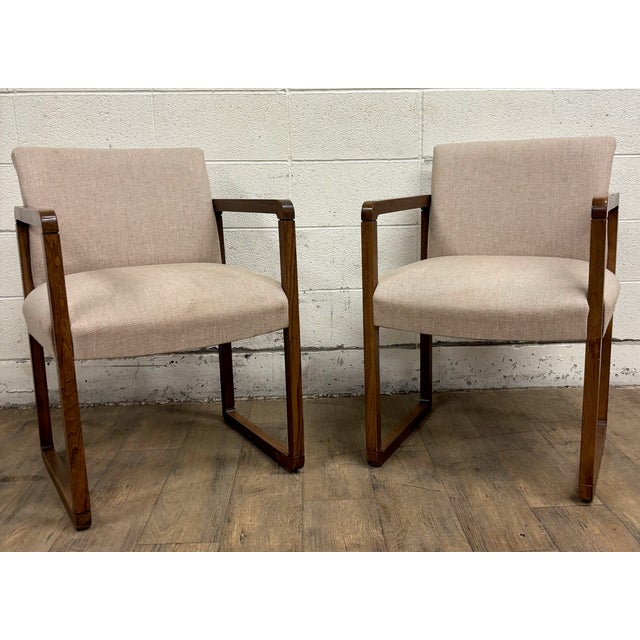 This is a stunning pair of vintage Mid Century Modern MCM Danish style dining arm chairs by The Hon Co. Wood appears to be...
