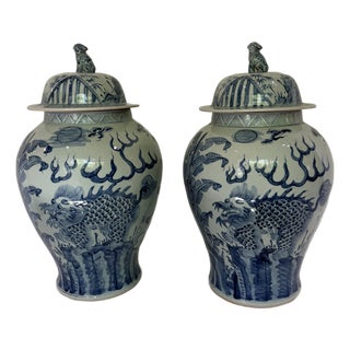 Pair Monumental Blue & White Chinese Porcelain Covered Dragon Temple Jars With Foo Dog Finials, 23” H For Sale