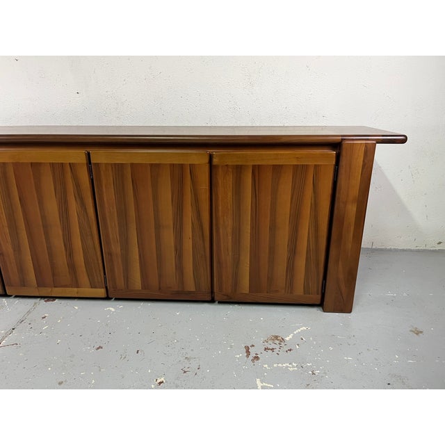 Four-door walnut sideboard with shelves and drawers from the Sapporo series, designed by Mario Marenco for Mobilgirgi in...