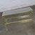 Fantastic vintage Modern coffee or cocktail table composed of a rectangular brass toned anodized aluminum frame with...