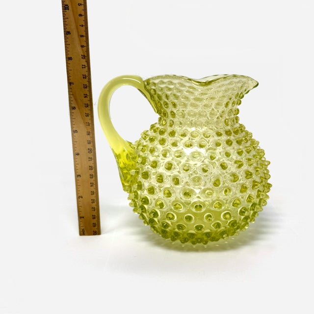 This is a stunning example of Victorian-era art glass: an authentic Hobbs, Brockunier & Co. Vaseline glass pitcher in the...