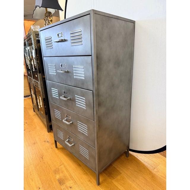 Industrial steel storage chest with a clean, utilitarian silhouette and wonderful timeworn patina. This substantial five-...