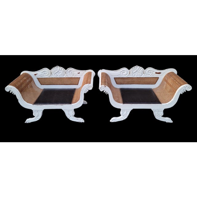 Featured is a glorious pair of Painted Antique Anglo-Indian Colonial Caned Leather Seat Settees. They have been stylishly...