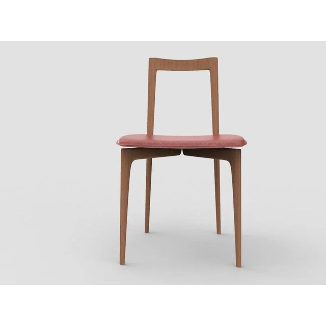 with its light and solid wood structure, this chair is suitable for contemporary interiors. Its proportions and reduced...