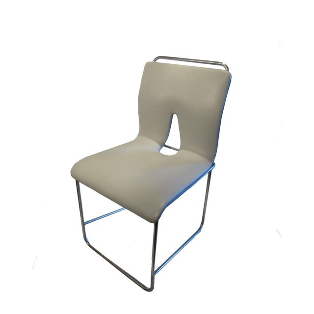 Mid-century Italian set of 2 modern side chairs, new light grey vinyl on original steel frame. Measures: 18.5”W (widest at...