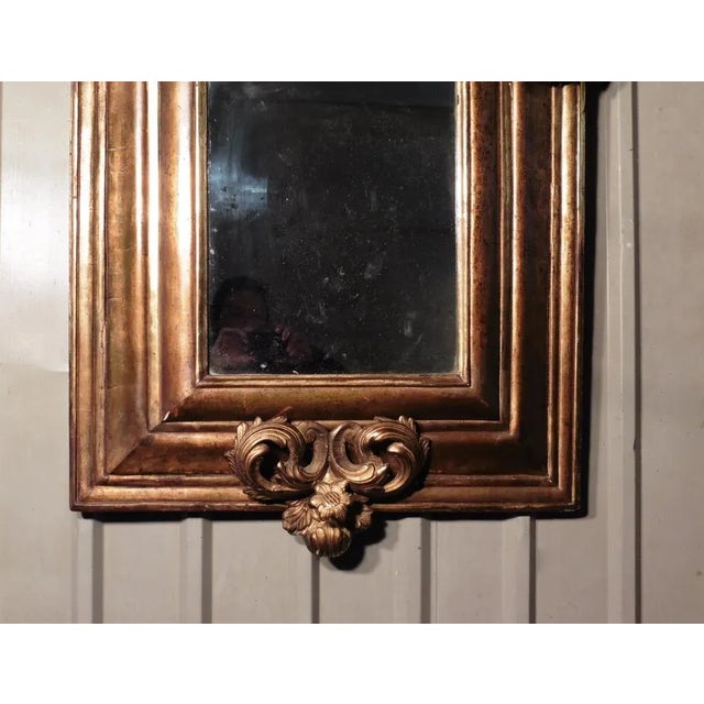 A Superb Large Early 19th Century Carved Gilt Mirror This is the most impressive large carved gilt mirror, the glass is...