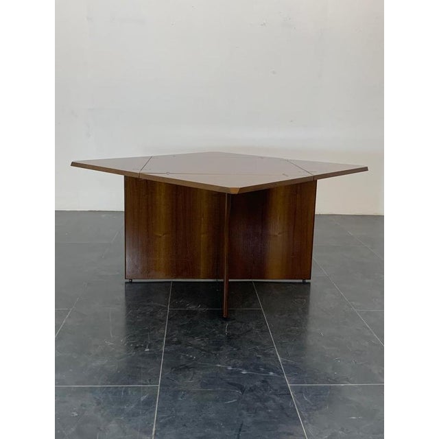 Table with beautiful selection walnut essence On an X base rests the plane that can be rotated and extendable with 4...