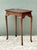 This exquisite vintage tea table captures the timeless grace of the Queen Anne period with its refined silhouette and...