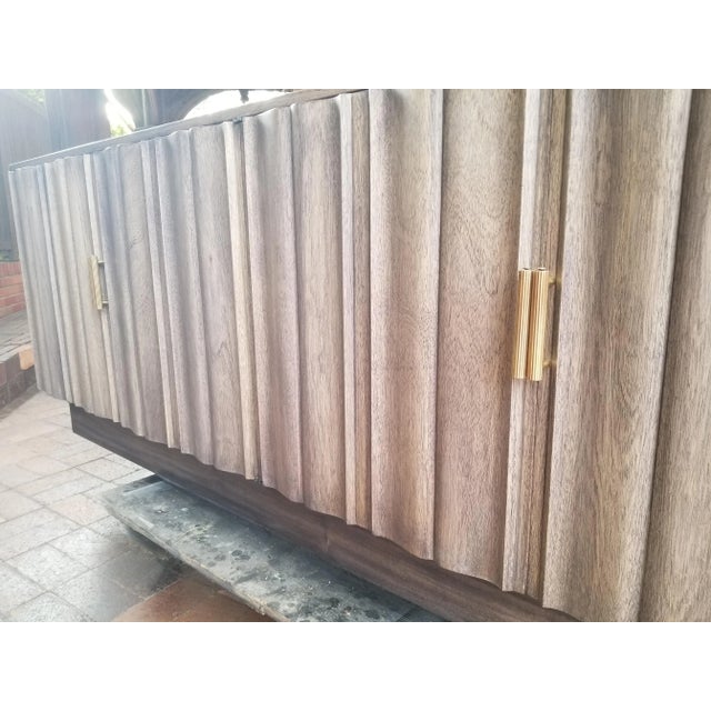 Important Credenza with Brass Handles in Fume' Mahogany. Pergamena motif on the doors and sides . White Finish inside and...