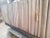 Important Credenza with Brass Handles in Fume' Mahogany. Pergamena motif on the doors and sides . White Finish inside and...