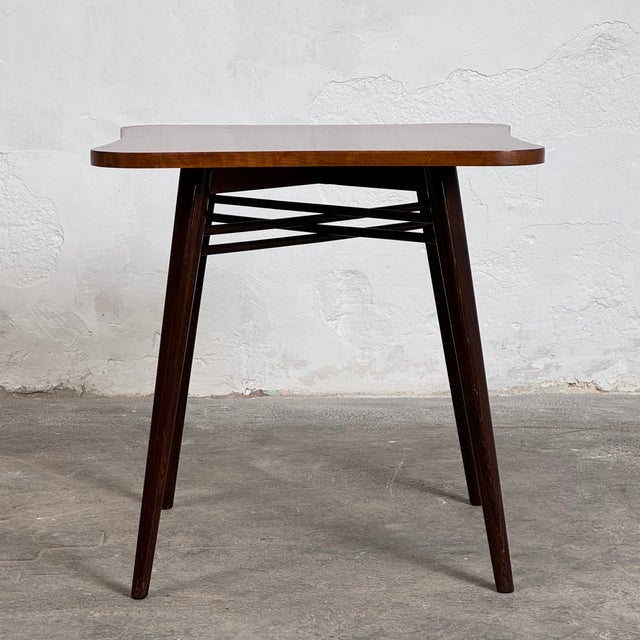 Original 1940s coffee table attributed to jindřich halabala, crafted with chestnut veneer and strong art deco proportions....