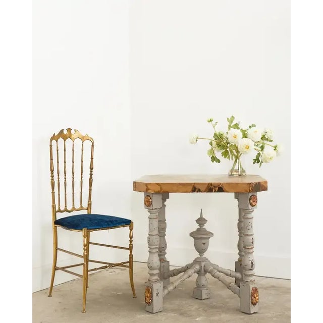 Fantastic French Louis XIV style center table featuring a faux-marble top with a painted bust by artist Ira Yeager...
