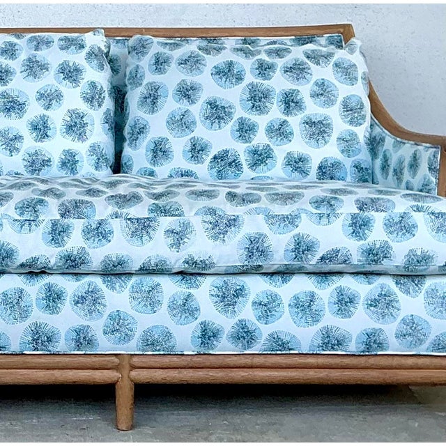 This exceptional vintage McGuire sofa is a masterclass in coastal sophistication and artisanal craftsmanship. Featuring...