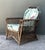 Embrace the timeless glamour of the "California Look" with this exceptional vintage stick rattan lounge chair. Drawing...