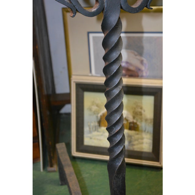 These are large iron andirons. Very gothic/castle looking! Heavy & solid.