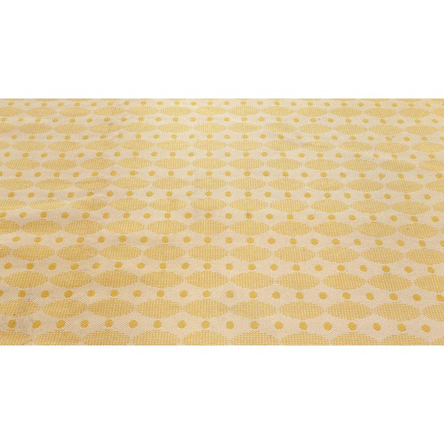 Mid-20th century Swedish yellow double sided fragment rug Measures: Size: 5'7" × 11'10" (170 × 360 cm) Size: 5'7" × 11'10"...