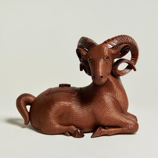 Remarkable Chinese ram with a removable lid ambitiously handcrafted in wicker or reed with carved wood hoofs and horns...