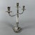 An exquisite three-light candelabra, a true jewel of 20th-century silverware. It stands out for its exceptional...