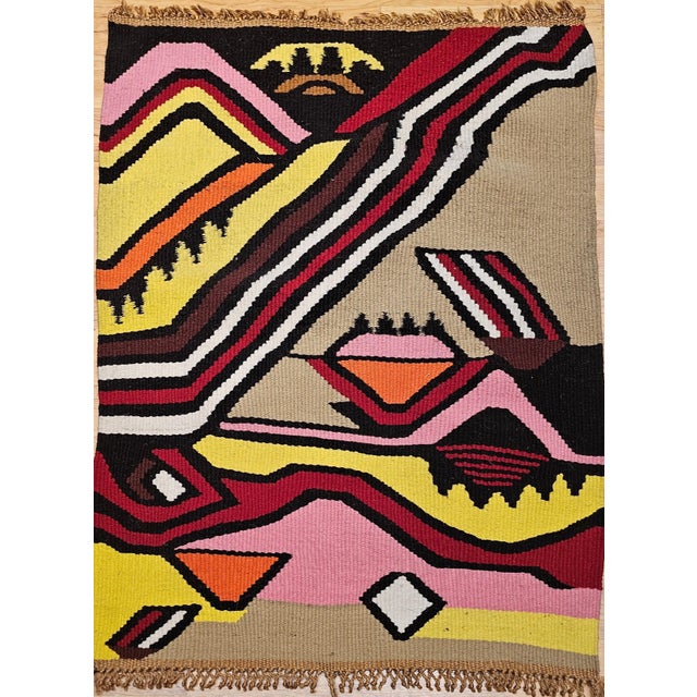 32” x 45” x .25” Wonderful and colorful handwoven tapestry wall art from the mid 1900s. The tapestry has an abstract...