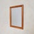 A 1950s Italian wall mirror with a soft, architectural presence. Framed in solid wood, its rectangular form features...