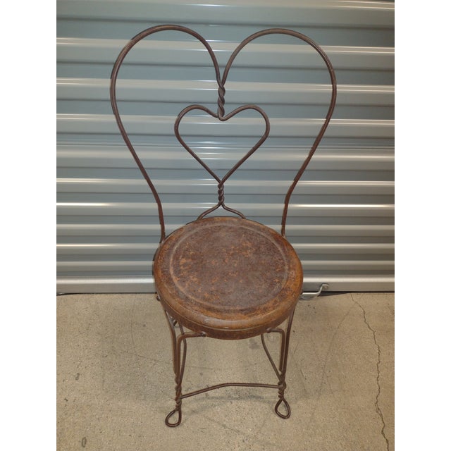 This is a vintage wrought iron Sweetheart Chair Made in the mid 20th century of beautiful wrought iron. There is no...