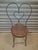 This is a vintage wrought iron Sweetheart Chair Made in the mid 20th century of beautiful wrought iron. There is no...