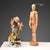 Polychrome porcelain sculpture depicting a caricatured violinist. The sculpture's vivid rendering and attention to detail...