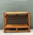 This vintage rattan sideboard is a stunning example of mid-century coastal elegance, featuring a distinctive open-grid...