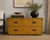 A striking Henredon Fine Furniture campaign-inspired two-drawer chest featuring a rich golden faux shagreen finish and...