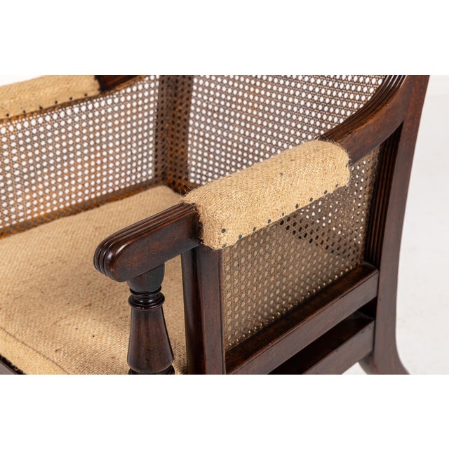 A fine regency mahogany bergère library armchair in the manner of gillows c.1825. This form of library chair with caned...