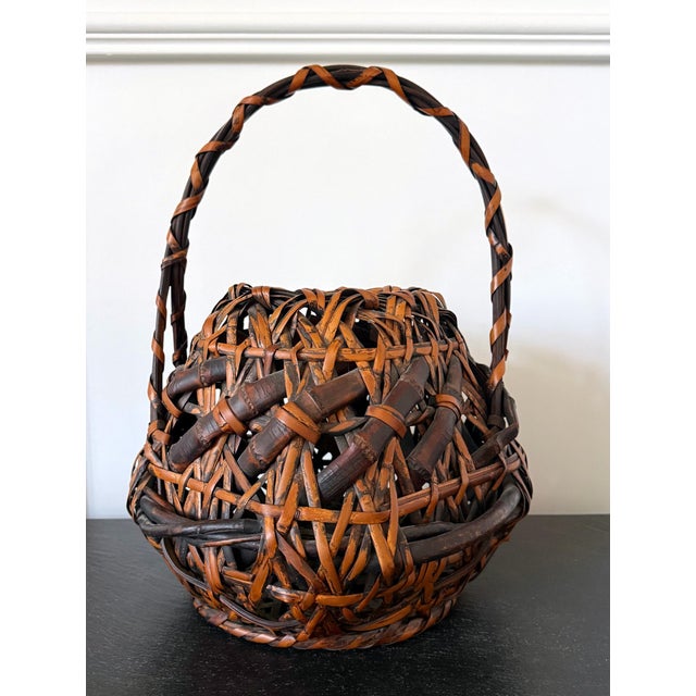 A fantastic hand-woven Japanese ikebana bamboo basket from an unknown artist circa late Meiji Period (1868-1912). It...