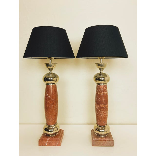 A striking set of very heavy table lamps in red marble with chromed metal details. The lamps have a robust but at the same...