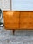 Elegant French Art Deco sideboard dating to circa 1950, featuring a beautifully figured warm-toned wood façade with...