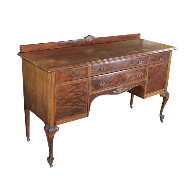 An Antique early 20th century French Country buffet or server, circa 1900. Drawing inspiration from Chippendale and Queen...