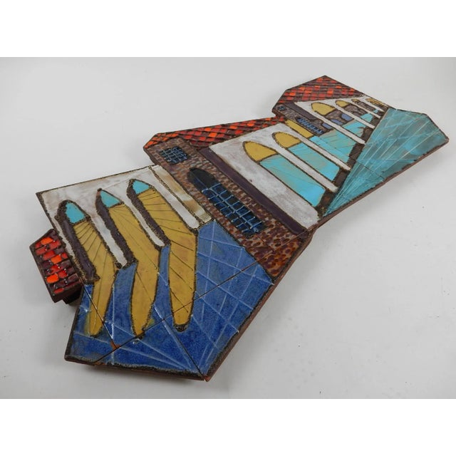 Large asymmetrical architectural ceramic tile wall art. Beautiful color glazes of turquoise, red and blue. Hangs on 2 D...