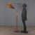 Vintage floor lamp with adjustable height and adjustable stem, featuring a brass base and structure with leather-covered...