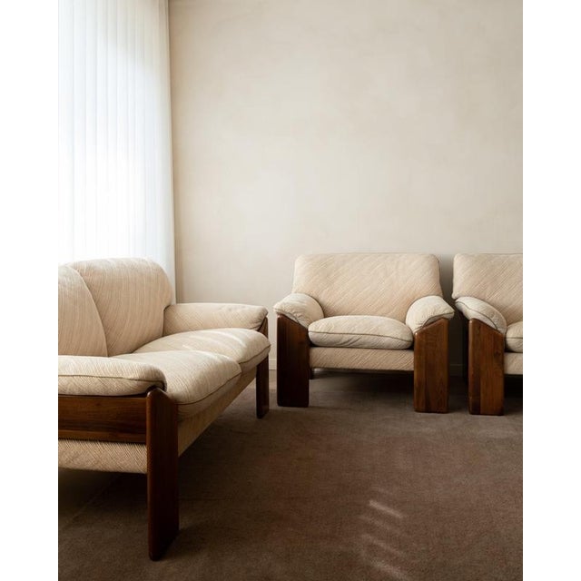 A vintage sapporo seating group in solid walnut with original cream textured upholstery, designed by mario marenco for...