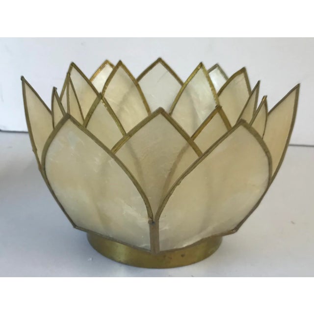 Beautiful Capiz shell and brass votive candle holder in the shape of a flower.