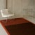 The Licorice rug with stripes of brown that flow into a deep red, reflecting richness, spice, and luxury. A bold, modern...