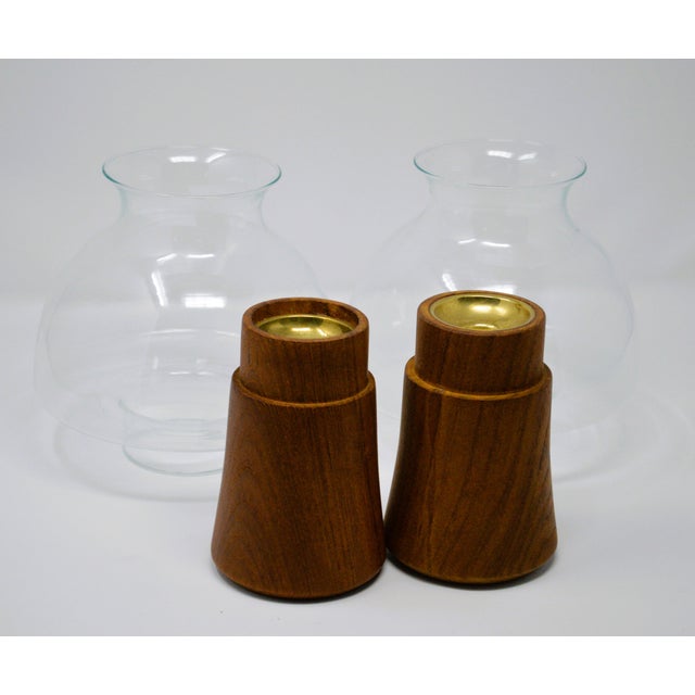 Dansk Jens Quistgaard Teakwood Brass Glass Hurricane Candleholders a-Pair. The candlesticks are used in good condition...