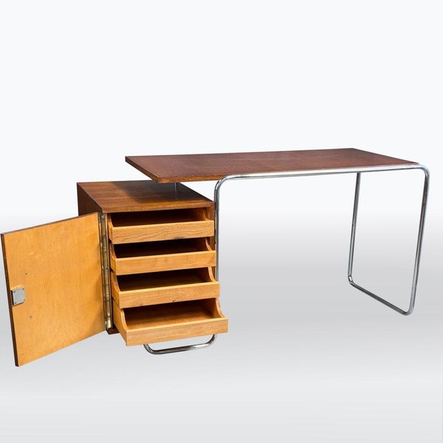 A minimalist desk in the spirit of Czech functionalism, most likely made in the 1930s. The frame is crafted from bent...