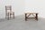 A solid oak trestle bench from France, dating to around 1900. This piece exemplifies the straightforward utility and...