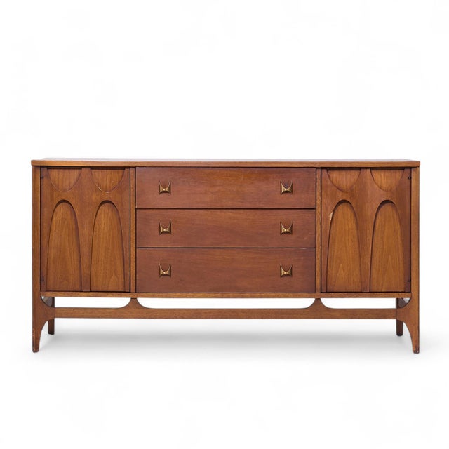 Broyhill Brasilia Mid Century Walnut and Brass Credenza This credenza measures: 56 wide x 17 deep x 28 inches high Fair...
