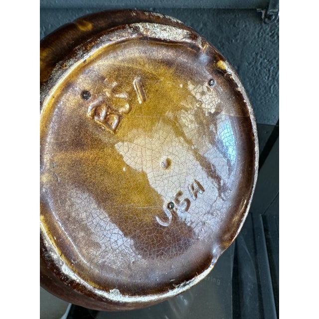 Mid century Made in USA, hand made dripped glazed brown and white pottery planter. Marked USA on underside.