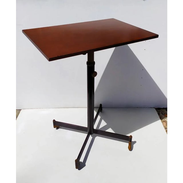 This TV stand with wheels and height-adjustable central rod was designed by Gardella in the 1950s (attributed for form and...